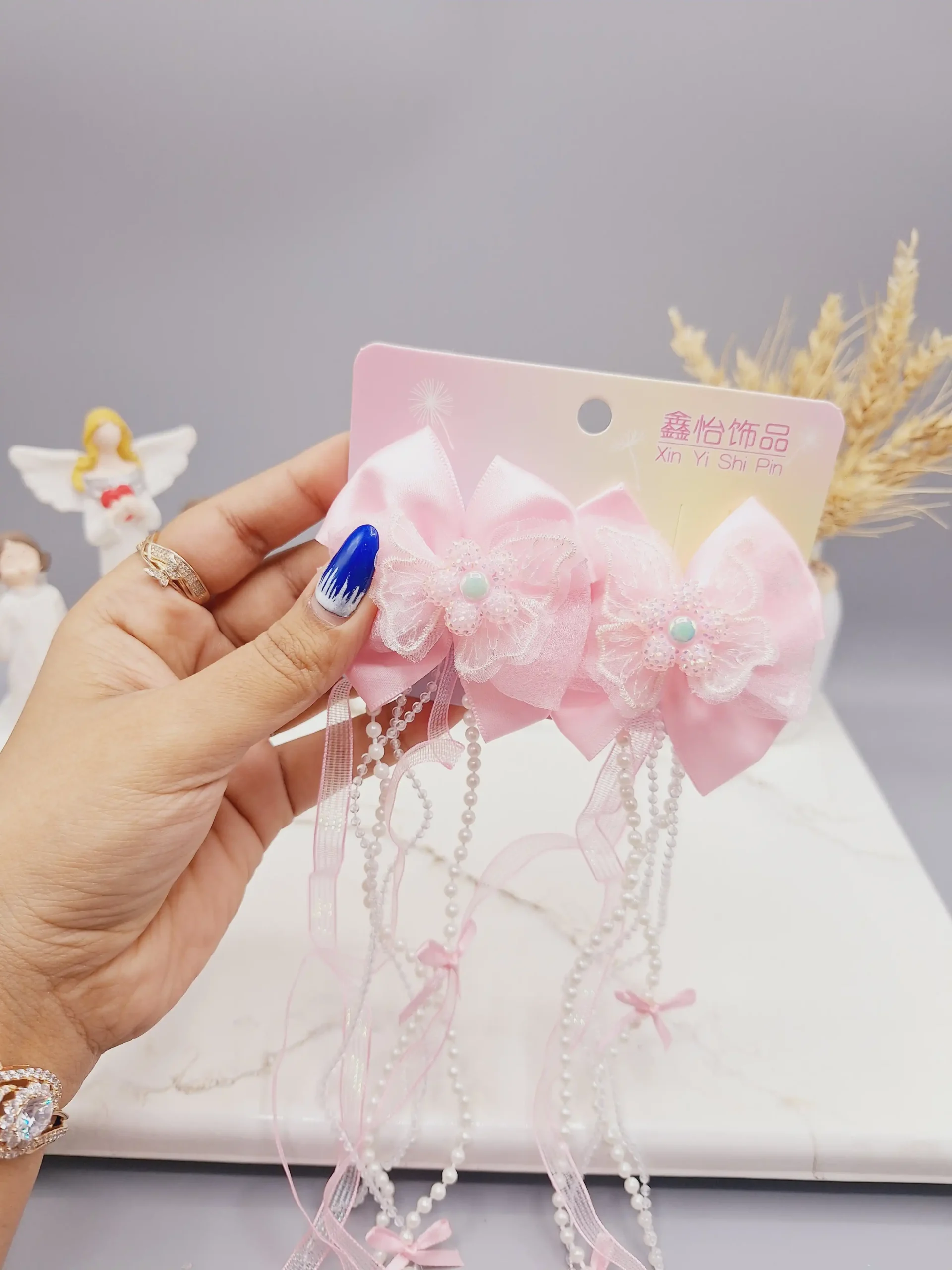 20250731060409106-thumbnail ست 2 تایی گیره مو پاپیونی و گل همراه با آویز نواری و نگین دار - تصویر 1