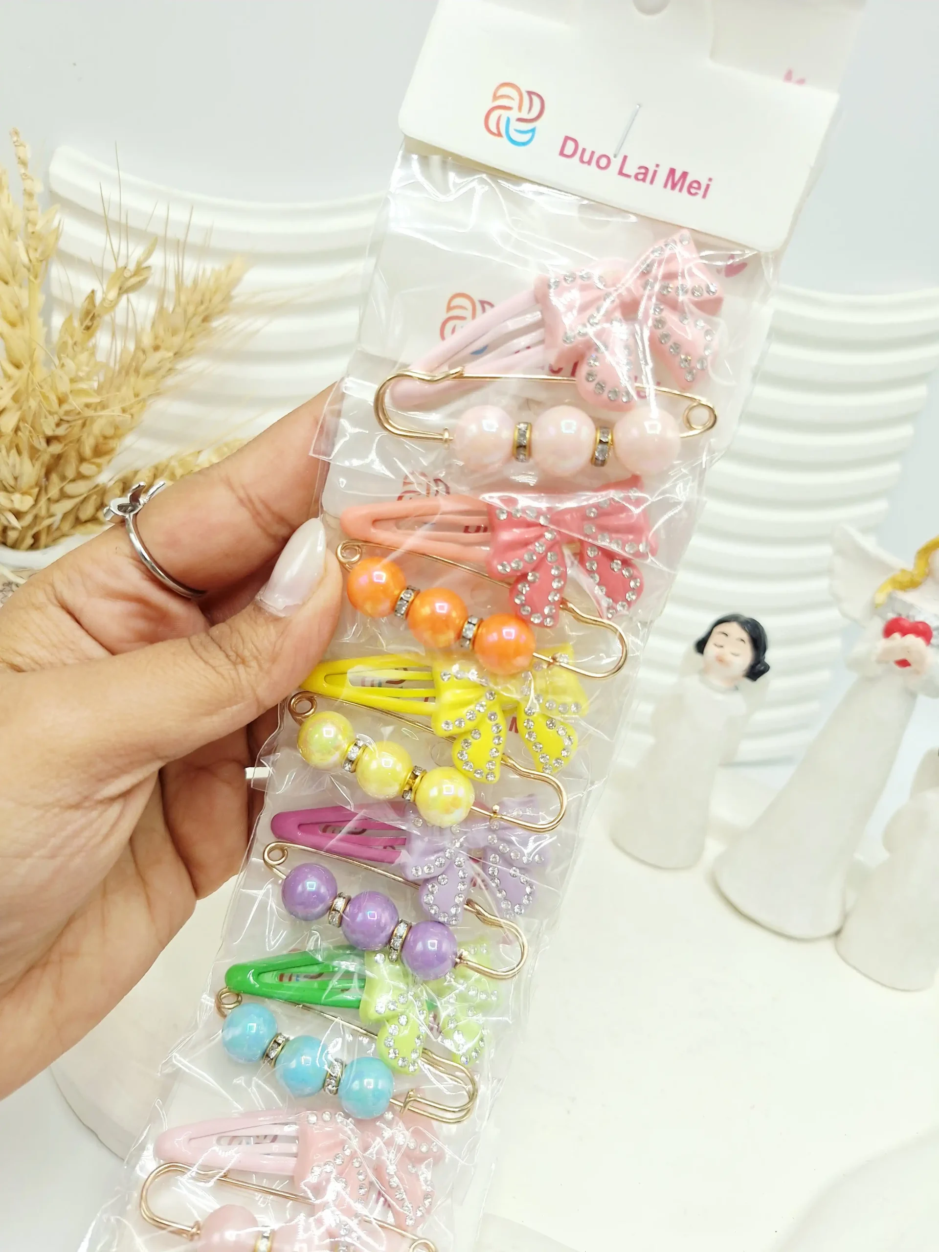 20251118221456435-thumbnail ست 10 تایی پنس و سنجاق پاپیون نگین دار - تصویر 1